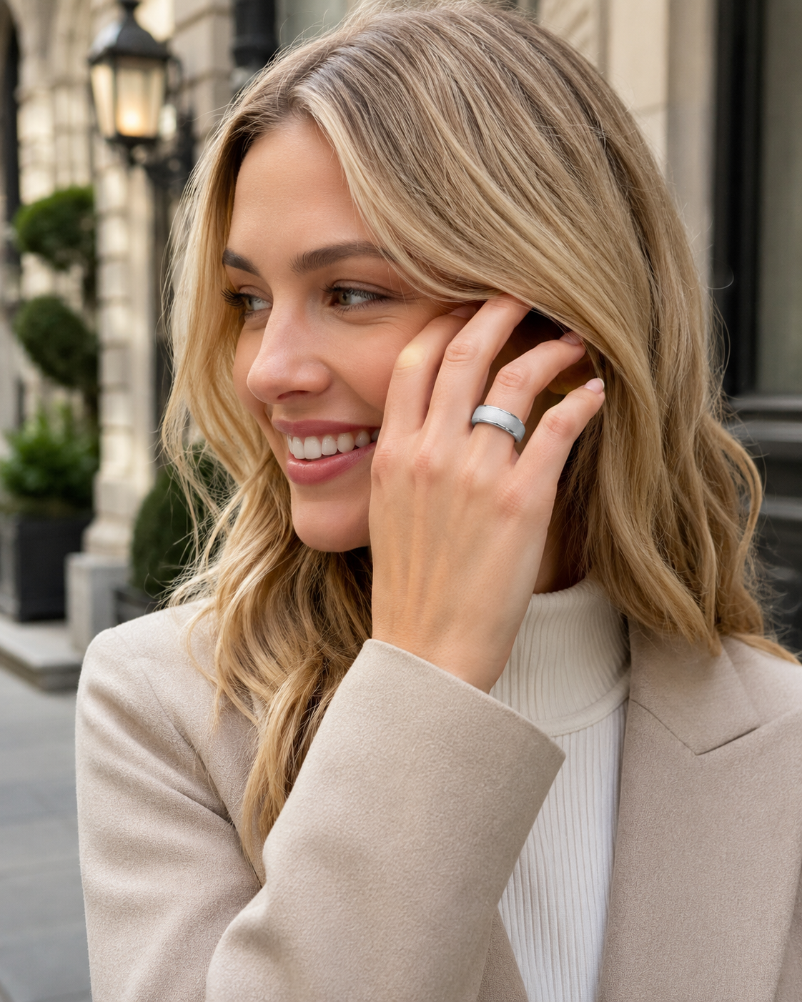 Woman wearing a COLMI R10 smart ring in an outdoor street-style portrait