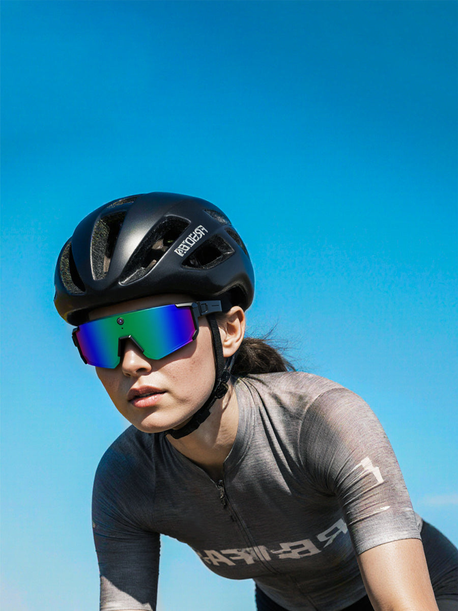 Woman cyclist wearing COLMI cycling AI smart glasses