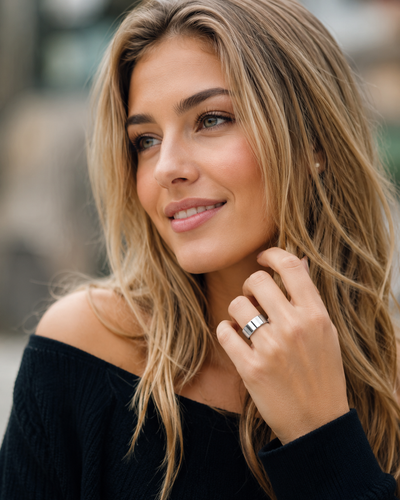 Woman wearing a COLMI R02 smart ring with a black top