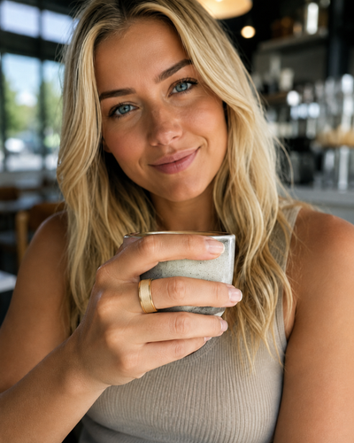 Woman wearing a COLMI R10 smart ring in a cafe portrait